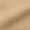 Textura de tela gabardina beige resistente para ropa de trabajo