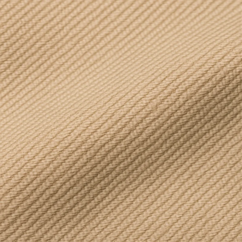 Textura de tela gabardina beige resistente para ropa de trabajo